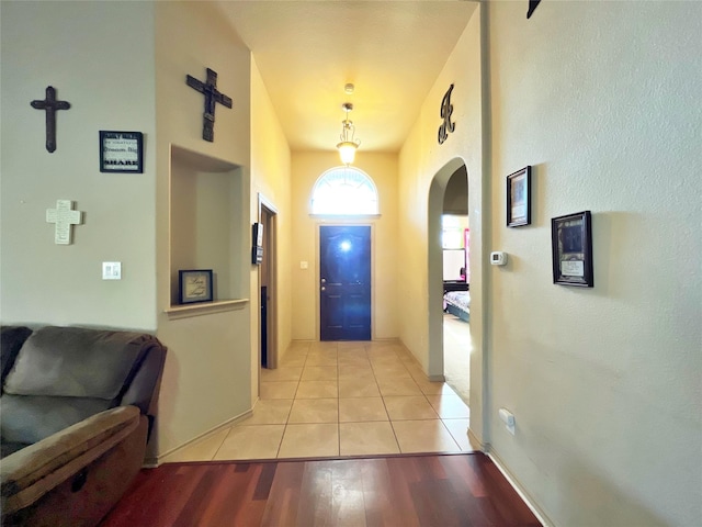 corridor with light tile patterned floors