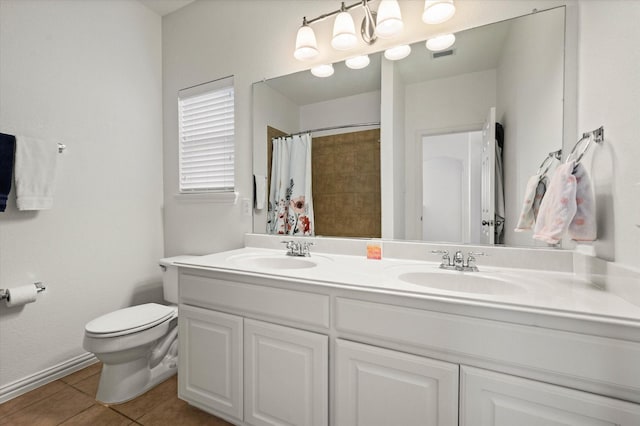 bathroom with toilet, tile patterned floors, walk in shower, and vanity