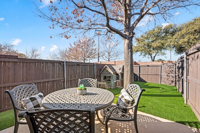 view of patio / terrace featuring an outbuilding