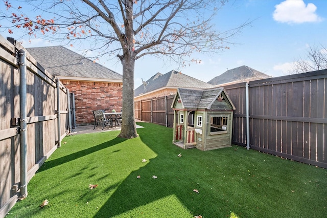 view of yard with a patio area and an outdoor structure