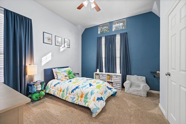 bedroom with ceiling fan, carpet, and lofted ceiling