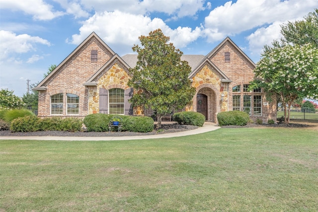 view of property featuring a front yard