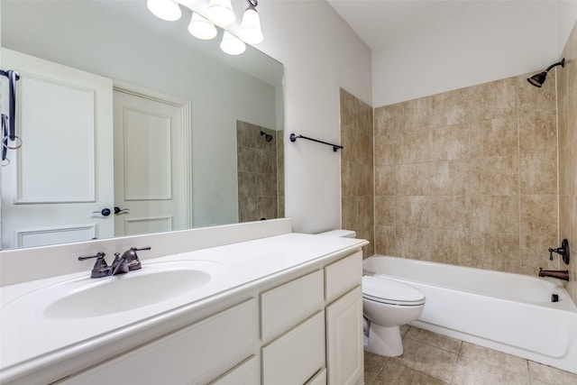 full bathroom with toilet, vanity, tiled shower / bath combo, and tile patterned floors