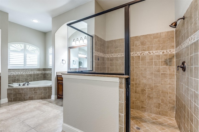 bathroom featuring vanity, tile patterned floors, and independent shower and bath