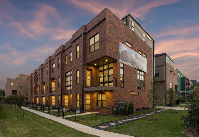 view of outdoor building at dusk