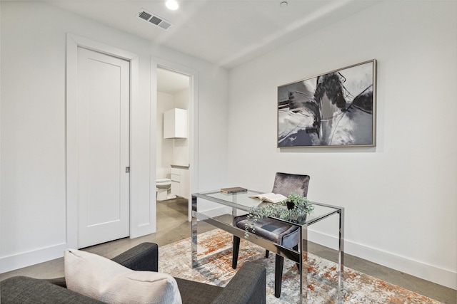 office with concrete flooring