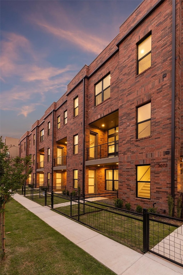 view of outdoor building at dusk