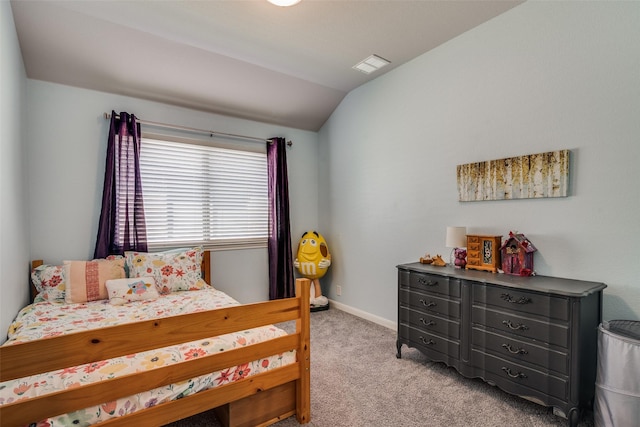 bedroom featuring light carpet and lofted ceiling