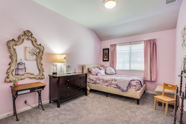 carpeted bedroom with vaulted ceiling