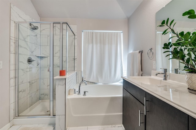 bathroom with vaulted ceiling, separate shower and tub, and vanity