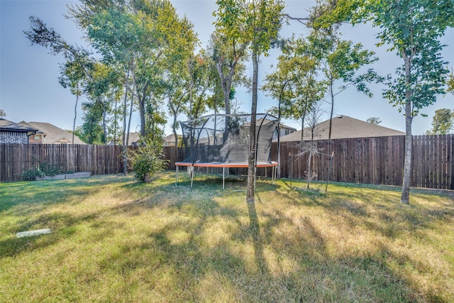 view of yard with a trampoline