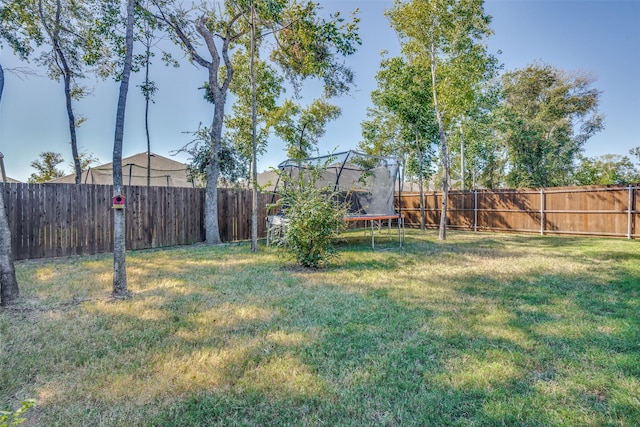 518 Whitney Ln, Lavon, TX 75166 - view of yard featuring a fenced backyard and a trampoline