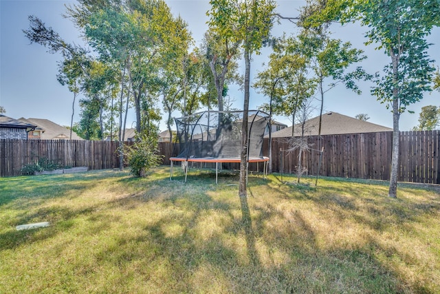 518 Whitney Ln, Lavon, TX 75166 - view of yard featuring a fenced backyard and a trampoline