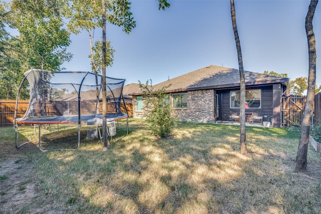 518 Whitney Ln, Lavon, TX 75166 - ranch-style home with brick siding, a garage, roof with shingles, a front lawn, and concrete driveway