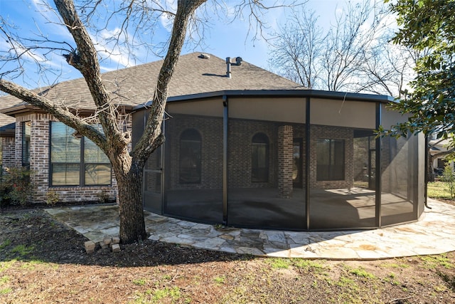 back of property with a patio