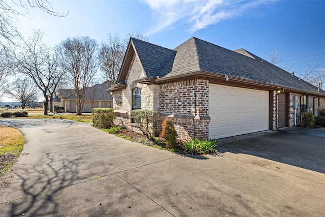 view of side of property with a garage