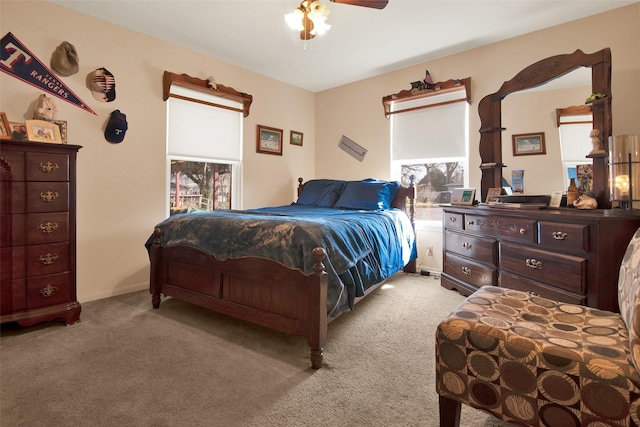 carpeted bedroom with ceiling fan