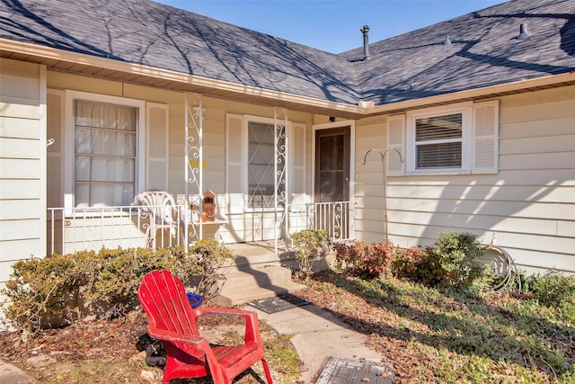 entrance to property featuring a porch