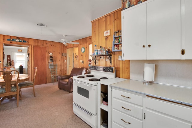 kitchen with ceiling fan, white cabinets, and white electric range