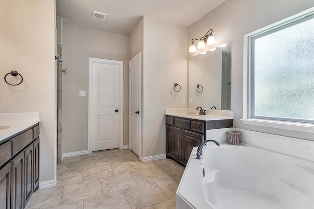 bathroom featuring a bathtub and vanity