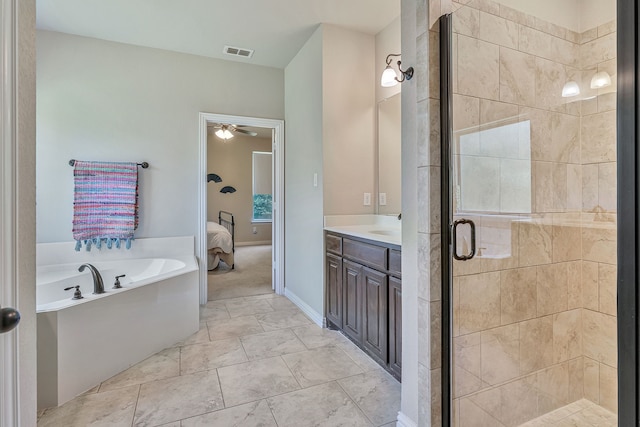 bathroom featuring ceiling fan, vanity, and plus walk in shower