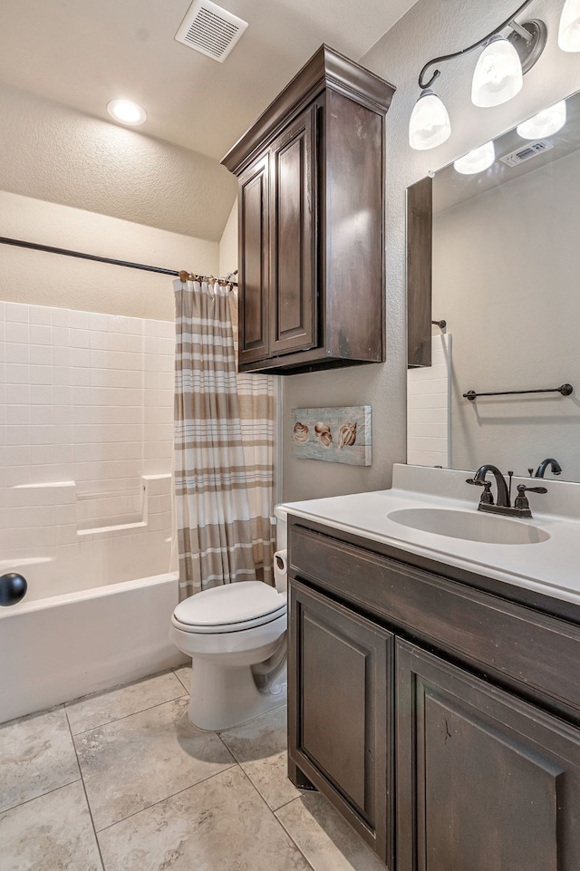 full bathroom with toilet, vanity, tile patterned flooring, and shower / bath combo with shower curtain