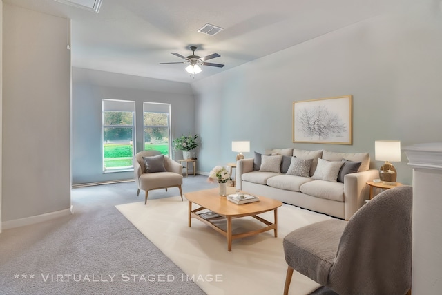 living room with ceiling fan, light carpet, and vaulted ceiling