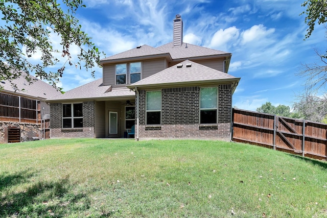 back of house with a yard