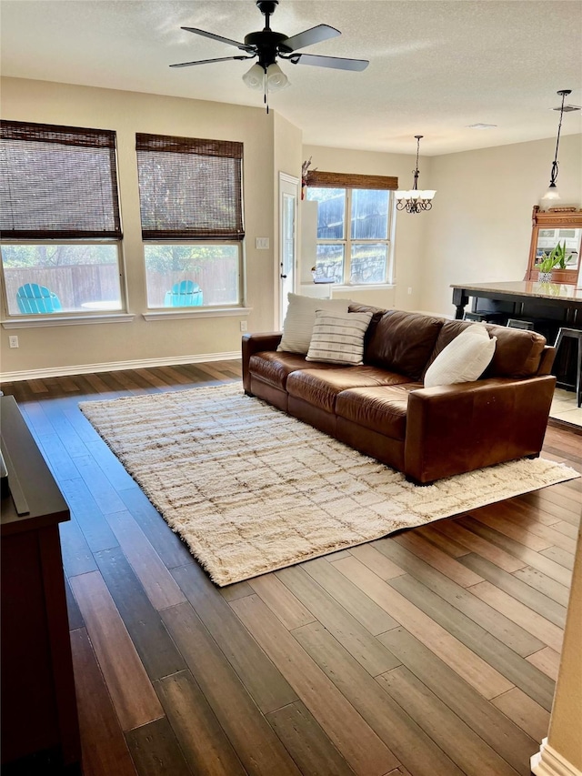 living room with ceiling fan and hardwood / wood-style floors