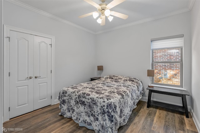 bedroom with ceiling fan, dark hardwood / wood-style flooring, a closet, and ornamental molding