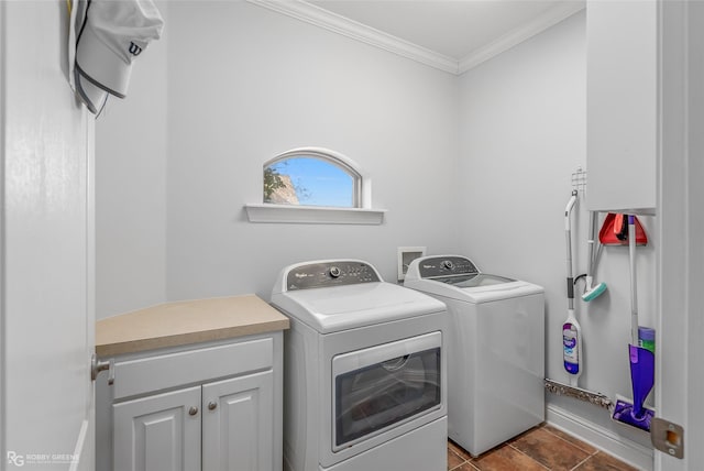 washroom with crown molding, tile patterned floors, separate washer and dryer, and cabinets