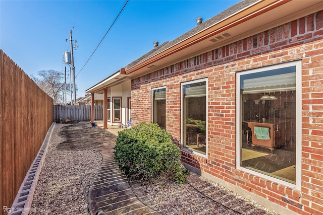 rear view of property featuring a patio area