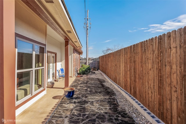 view of property exterior with a patio