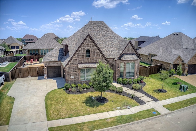 view of front of property featuring a garage and a front yard