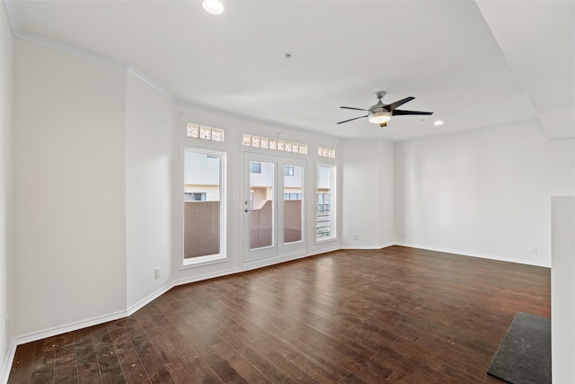 unfurnished room featuring ceiling fan, dark wood-type flooring, and crown molding