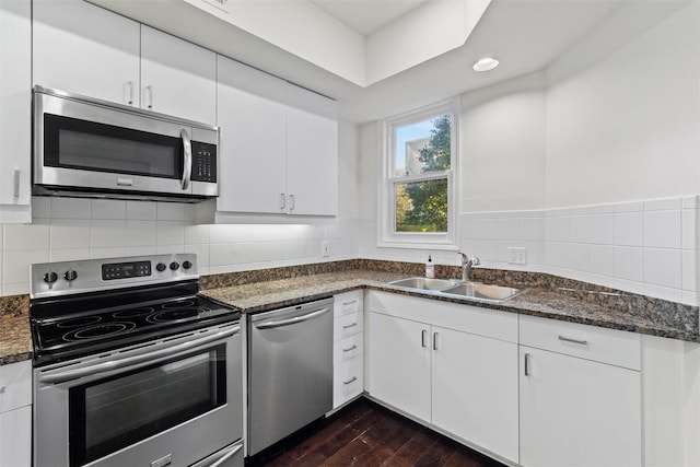 kitchen with white cabinets, sink, and stainless steel appliances