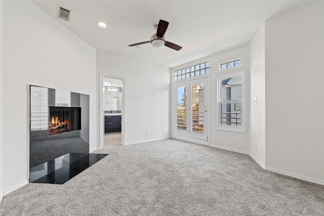 living room featuring carpet floors and ceiling fan