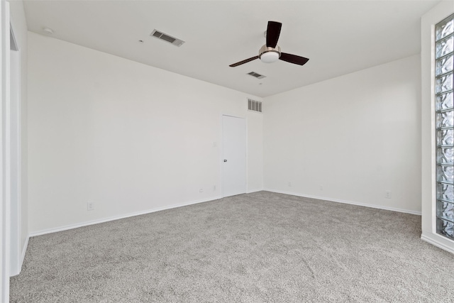 empty room featuring ceiling fan and carpet flooring