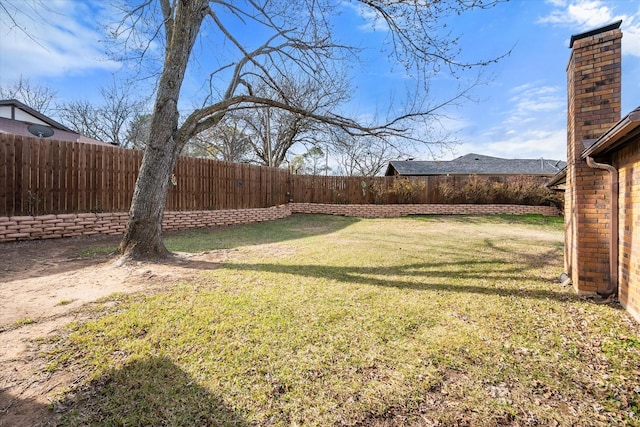 view of yard featuring a fenced backyard