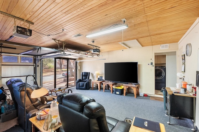 carpeted living area featuring a garage, wood ceiling, visible vents, and washer / clothes dryer