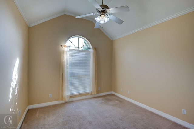 empty room with ceiling fan, crown molding, light carpet, and vaulted ceiling