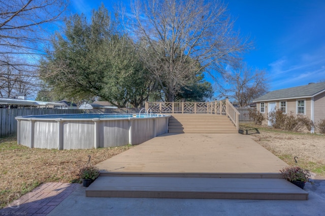 exterior space with a fenced in pool