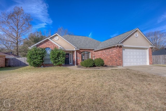 ranch-style home with a garage and a front yard