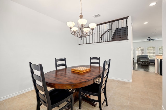 dining area with visible vents, ceiling fan with notable chandelier, recessed lighting, light tile patterned floors, and baseboards