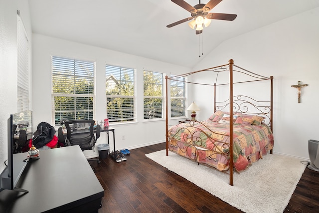 bedroom with lofted ceiling, wood finished floors, baseboards, and ceiling fan