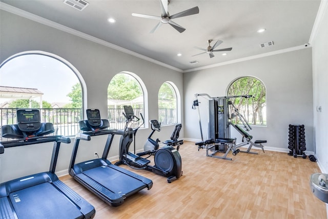 exercise room with visible vents, baseboards, and wood finished floors