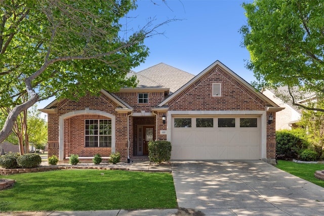 view of front of home with a front lawn and a garage