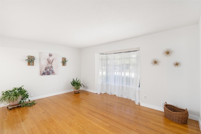 empty room featuring hardwood / wood-style floors