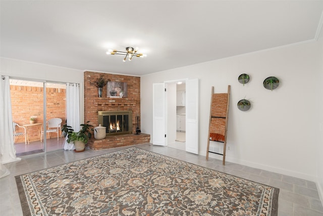 living room with an inviting chandelier and a fireplace