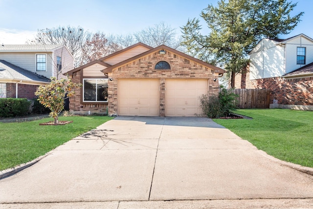 view of front of home featuring a front yard and a garage